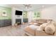 Inviting living room featuring a fireplace, large sectional sofa, and ample natural light at 8616 Deep Elm Dr, Wake Forest, NC 27587