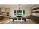 Elegant dining room with large windows, a modern chandelier, and seating for eight at 909 Oberlin Rd, Raleigh, NC 27605