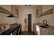 This laundry room has a black washer and dryer, granite countertops, and plenty of storage at 909 Oberlin Rd, Raleigh, NC 27605