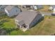 Aerial view of a gray-sided home with a covered patio and well-maintained yard in a residential neighborhood at 94 Shooting Star Ln, Clayton, NC 27520