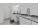 Modern bathroom boasts dual sinks, spacious countertop, ample lighting, and a separate toilet at 94 Shooting Star Ln, Clayton, NC 27520