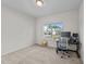 Bright bedroom features a neutral color scheme, large window, and space for work or relaxation at 94 Shooting Star Ln, Clayton, NC 27520