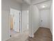 Inviting home hallway features hardwood floors, leading to rooms with neutral walls and white doors at 94 Shooting Star Ln, Clayton, NC 27520