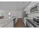 Modern kitchen features granite countertops and stainless steel appliances at 94 Shooting Star Ln, Clayton, NC 27520