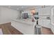 Stylish kitchen featuring an island, stainless steel appliances, white cabinetry, and plenty of counter space at 94 Shooting Star Ln, Clayton, NC 27520
