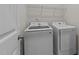 Bright laundry room featuring a new Samsung washer and dryer and wire shelving at 94 Shooting Star Ln, Clayton, NC 27520