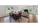 Open concept living area with wood floors, natural light, and a ceiling fan at 94 Shooting Star Ln, Clayton, NC 27520