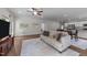 Well-lit living room with wood floors, neutral paint, and modern decor at 94 Shooting Star Ln, Clayton, NC 27520