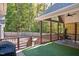 Relaxing outdoor space features a covered patio, outdoor furniture, and a manicured yard at 100 Bradborne Cir, Clayton, NC 27520