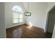 Formal dining room showcasing hardwood floors, modern chandelier, and built-in cabinetry at 100 Bradborne Cir, Clayton, NC 27520
