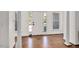 Bright foyer featuring hardwood floors and large windows, providing a warm welcome at 100 Bradborne Cir, Clayton, NC 27520