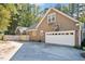 Attached two-car garage and adjacent fenced area at 100 Bradborne Cir, Clayton, NC 27520