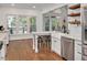 Bright kitchen with stainless steel appliances, white cabinetry, and a butcher block island at 100 Bradborne Cir, Clayton, NC 27520
