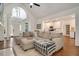 Open living space with hardwood floors, an arched ceiling, and seamless access to the kitchen at 100 Bradborne Cir, Clayton, NC 27520