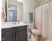 Modern bathroom with a gray vanity and a shower/tub combination at 104 Lingonberry Dr, Holly Springs, NC 27540