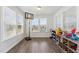 Versatile bonus room with wood floors and natural light at 104 Lingonberry Dr, Holly Springs, NC 27540