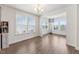 Sunlit dining area featuring natural light and lovely wood floors at 104 Lingonberry Dr, Holly Springs, NC 27540