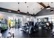 Well-equipped gym featuring modern exercise machines, weights, and ceiling fans for a comfortable workout environment at 104 Lingonberry Dr, Holly Springs, NC 27540