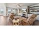 Inviting living room with a cozy fireplace, built-in shelving and lots of natural light at 104 Lingonberry Dr, Holly Springs, NC 27540