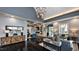 Inviting living room with sleek flooring, stylish furnishings, and modern lighting fixtures at 104 Lingonberry Dr, Holly Springs, NC 27540