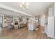 Spacious open-concept living and dining area seamlessly connecting the kitchen and seating area at 104 Lingonberry Dr, Holly Springs, NC 27540