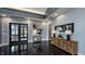 The lobby area has a unique decor, modern lighting, and sleek flooring, creating a welcoming atmosphere at 104 Lingonberry Dr, Holly Springs, NC 27540