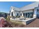 Modern outdoor fireplace area with stone surround and seating, perfect for entertaining guests at 104 Lingonberry Dr, Holly Springs, NC 27540