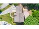 Overhead view shows the layout of the backyard with a deck and mature trees at 104 Ludstone Ct, Cary, NC 27513