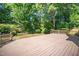 Large back deck perfect for outdoor entertaining, surrounded by lush greenery at 104 Ludstone Ct, Cary, NC 27513