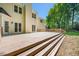 Large back deck with stairs is ideal for entertaining and relaxing with views of the backyard at 104 Ludstone Ct, Cary, NC 27513