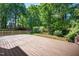 Large back deck perfect for outdoor entertaining, surrounded by lush greenery at 104 Ludstone Ct, Cary, NC 27513