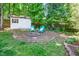 Cozy backyard fire pit with seating and storage shed is great for outdoor enjoyment at 104 Ludstone Ct, Cary, NC 27513
