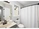 Clean bathroom features a neutral color palette, ample lighting, and modern fixtures at 104 Ludstone Ct, Cary, NC 27513