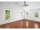 Bright, spacious bedroom featuring three large windows and ample closet space at 104 Ludstone Ct, Cary, NC 27513