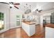Open kitchen layout with butcher block countertops, white cabinetry, and modern appliances at 104 Ludstone Ct, Cary, NC 27513