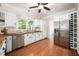 Bright kitchen with white cabinets, butcher block countertops, and stainless steel appliances at 104 Ludstone Ct, Cary, NC 27513