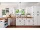 Bright kitchen with butcher block countertops, stainless steel appliances, and ample cabinet space at 104 Ludstone Ct, Cary, NC 27513