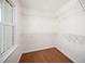 Walk-in closet with window and wire shelving and hardwood floors at 104 Ludstone Ct, Cary, NC 27513