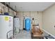 Basement area with utilities and a chair at 10825 Rondeau Woods Ct, Raleigh, NC 27614