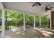 Covered deck with ceiling fans overlooking the backyard at 10825 Rondeau Woods Ct, Raleigh, NC 27614