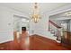 Elegant foyer with hardwood floors, staircase and a stunning chandelier at 10825 Rondeau Woods Ct, Raleigh, NC 27614