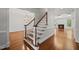 Elegant foyer with staircase, chandelier, and hardwood floors at 10825 Rondeau Woods Ct, Raleigh, NC 27614