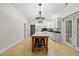 Bright kitchen with a large island, updated appliances and unique pendant lighting at 10825 Rondeau Woods Ct, Raleigh, NC 27614