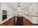 Gourmet kitchen with custom cabinets and stainless appliances at 10825 Rondeau Woods Ct, Raleigh, NC 27614