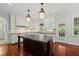 Spacious kitchen featuring a large island and granite countertops at 10825 Rondeau Woods Ct, Raleigh, NC 27614