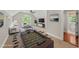 Entertainment space offers natural light and a foosball table at 10825 Rondeau Woods Ct, Raleigh, NC 27614