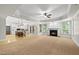 Open-concept great room featuring a fireplace and windows providing lots of light at 10825 Rondeau Woods Ct, Raleigh, NC 27614