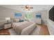 Comfortable bedroom features plush carpet, modern lighting and soothing decor at 10825 Rondeau Woods Ct, Raleigh, NC 27614