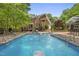 Backyard pool with an expansive deck and lounge chairs at 10825 Rondeau Woods Ct, Raleigh, NC 27614