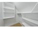 Organized walk-in closet with ample shelf space at 10825 Rondeau Woods Ct, Raleigh, NC 27614